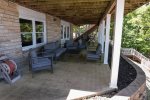 LOWER LEVEL LAKESIDE PATIO WITH SEATING TO ENJOY THOSE AWESOME LAKE VIEWS
